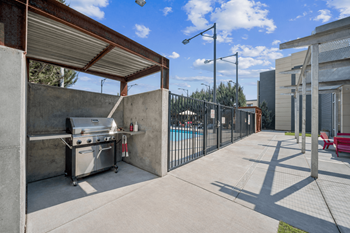 Covered bbq grill station with pool view
